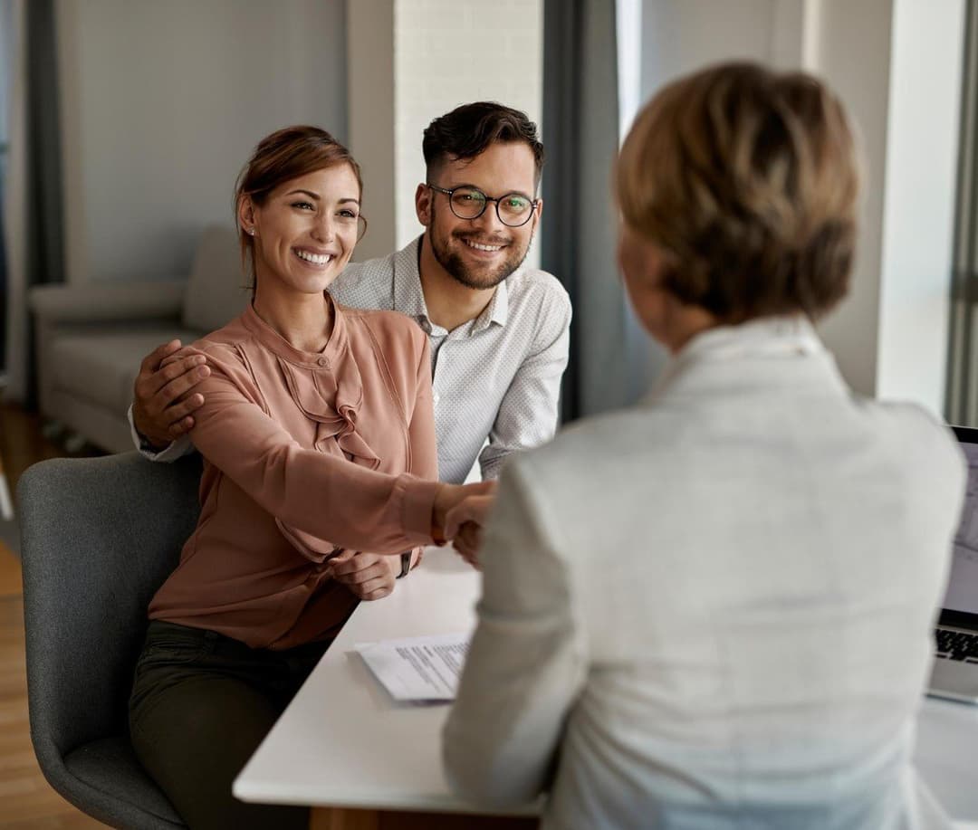 Professional lender helping couple with home mortgage consultation