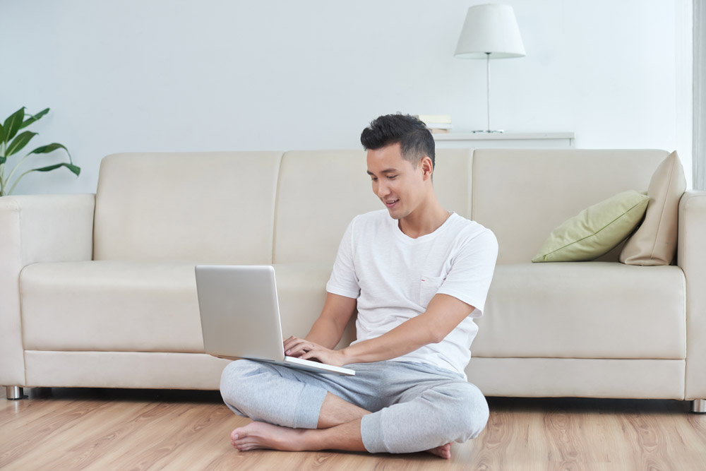 Image of a person sitting criss-cross applesauce but not using the couch for spinal support so I'd give it 15 or 20 minutes before some form of strain or ache sets in
